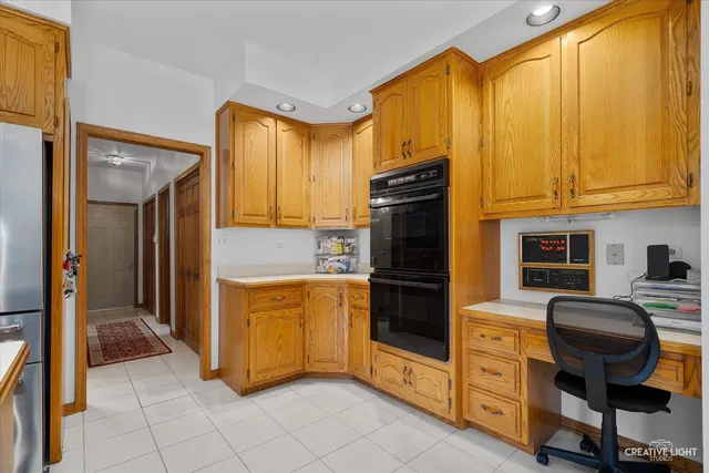 a kitchen with stainless steel appliances granite countertop a refrigerator and cabinets
