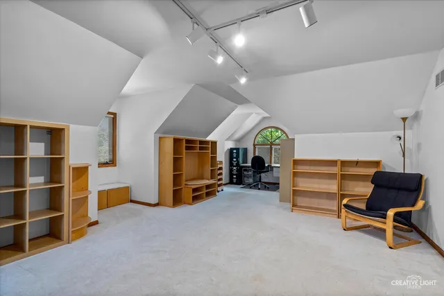 a view of a livingroom with furniture and a chair