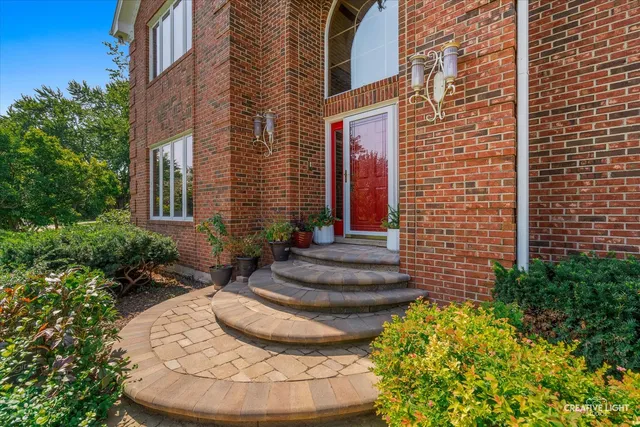 a view of a house with potted plants