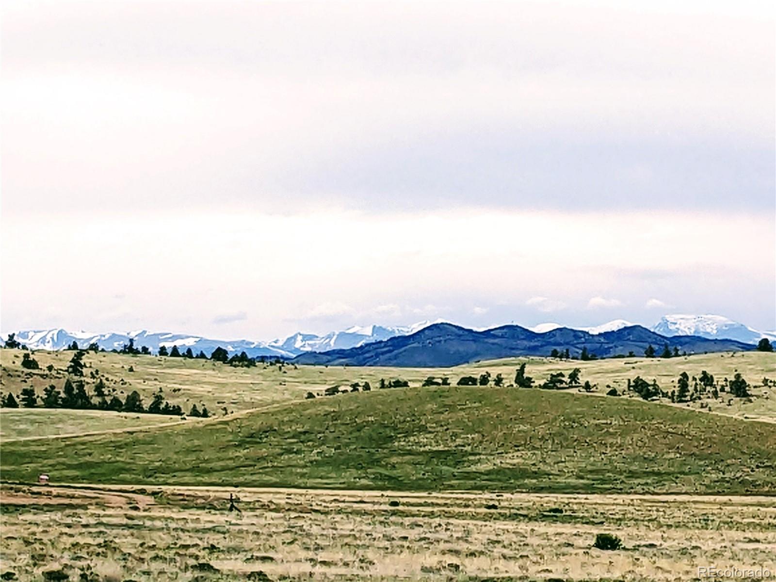 0 Downey Road Hartsel, CO 80449 - Photo 11 of 30 a view of an ocean with a mountain in the background