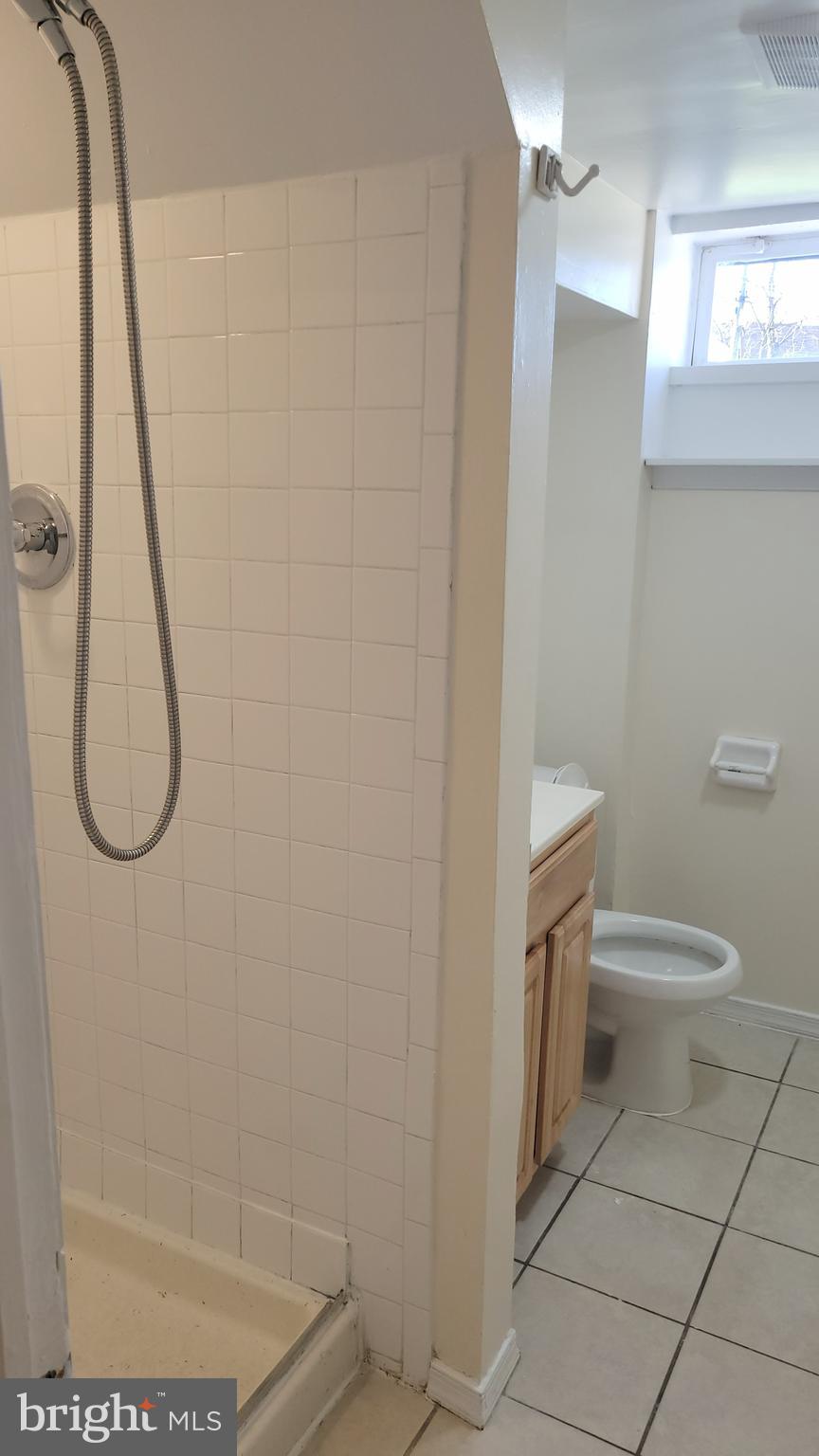 3217 Randall Road Suitland, MD 20746 - Photo 14 of 21 a bathroom with a toilet and shower