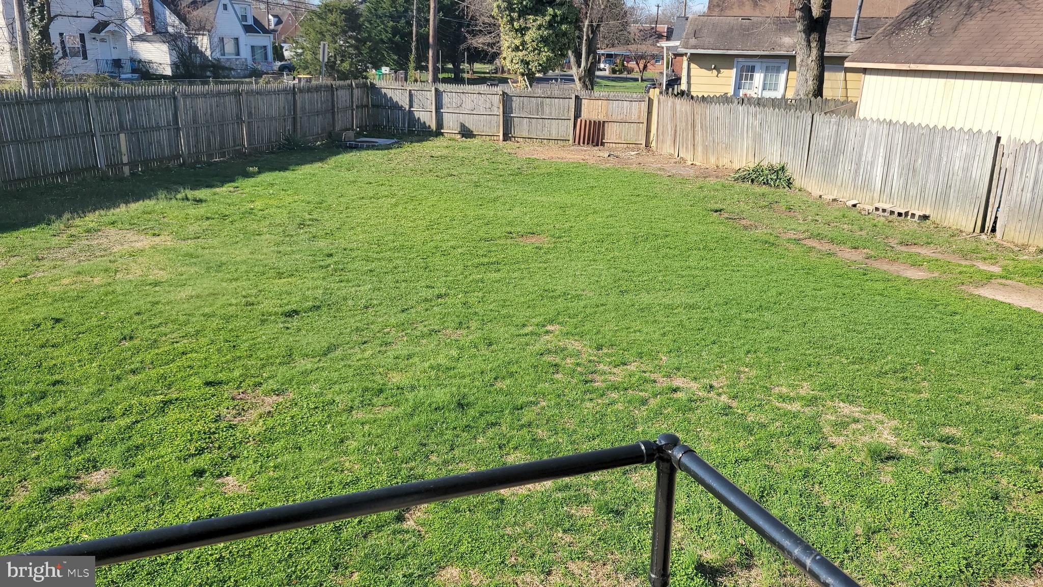 3217 Randall Road Suitland, MD 20746 - Photo 21 of 21 a view of a backyard with wooden fence