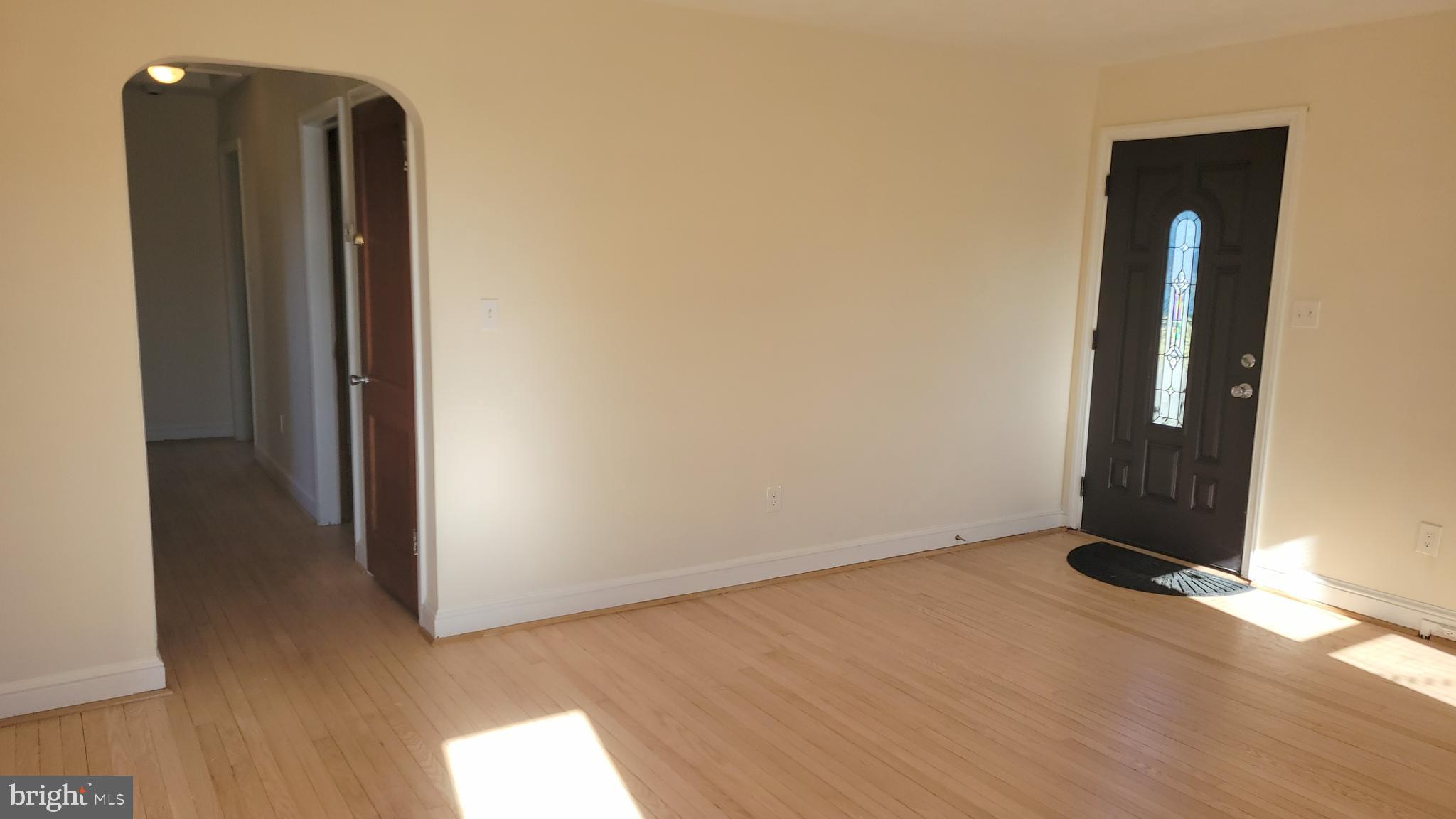 3217 Randall Road Suitland, MD 20746 - Photo 3 of 21 an empty room with wooden floor and closet