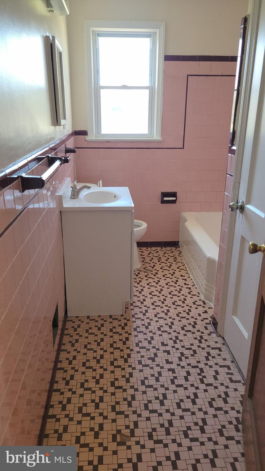 3217 Randall Road Suitland, MD 20746 - Photo 10 of 21 a bathroom with a bathtub and a shower