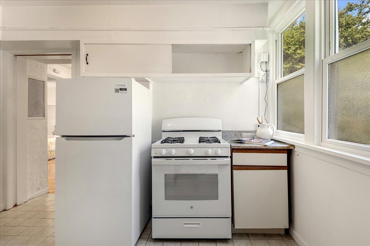 507 Easterby Street Sausalito, CA 94965 - Photo 25 of 90 a kitchen with a stove a refrigerator and a window