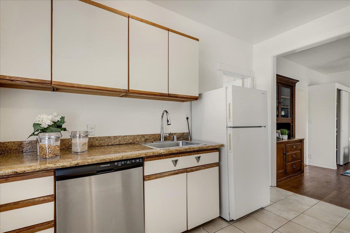 507 Easterby Street Sausalito, CA 94965 - Photo 42 of 90 a kitchen with stainless steel appliances granite countertop a sink and a refrigerator