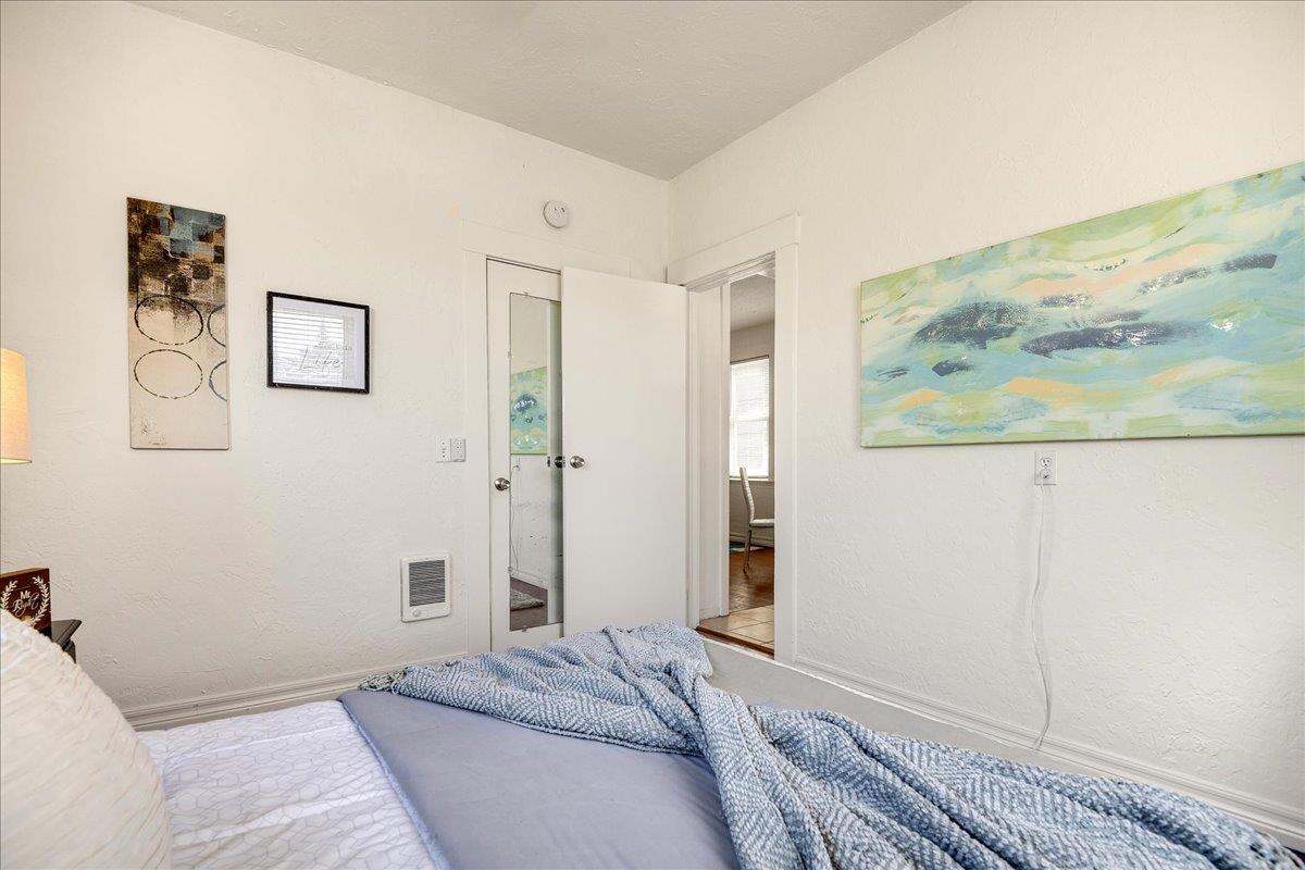 507 Easterby Street Sausalito, CA 94965 - Photo 45 of 90 a bedroom with a bed and a painting on the wall