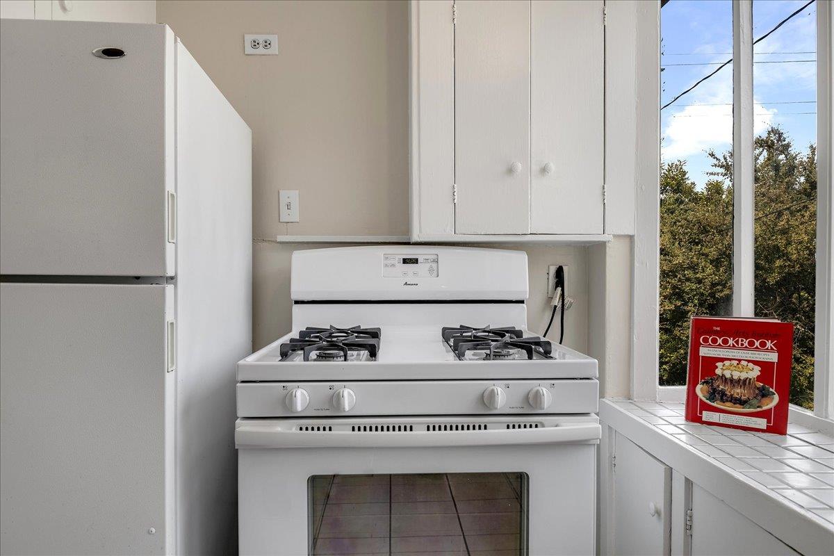 507 Easterby Street Sausalito, CA 94965 - Photo 59 of 90 a kitchen with stove and cabinets