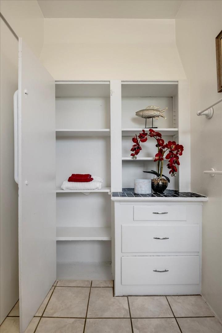 507 Easterby Street Sausalito, CA 94965 - Photo 67 of 90 a hallway with a cabinets and wooden floor