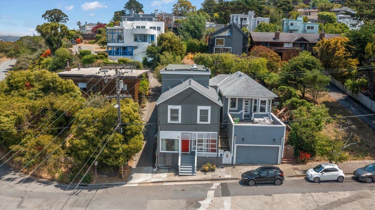 507 Easterby Street Sausalito, CA 94965 - Photo 8 of 90 a front view of a house with a yard and garage