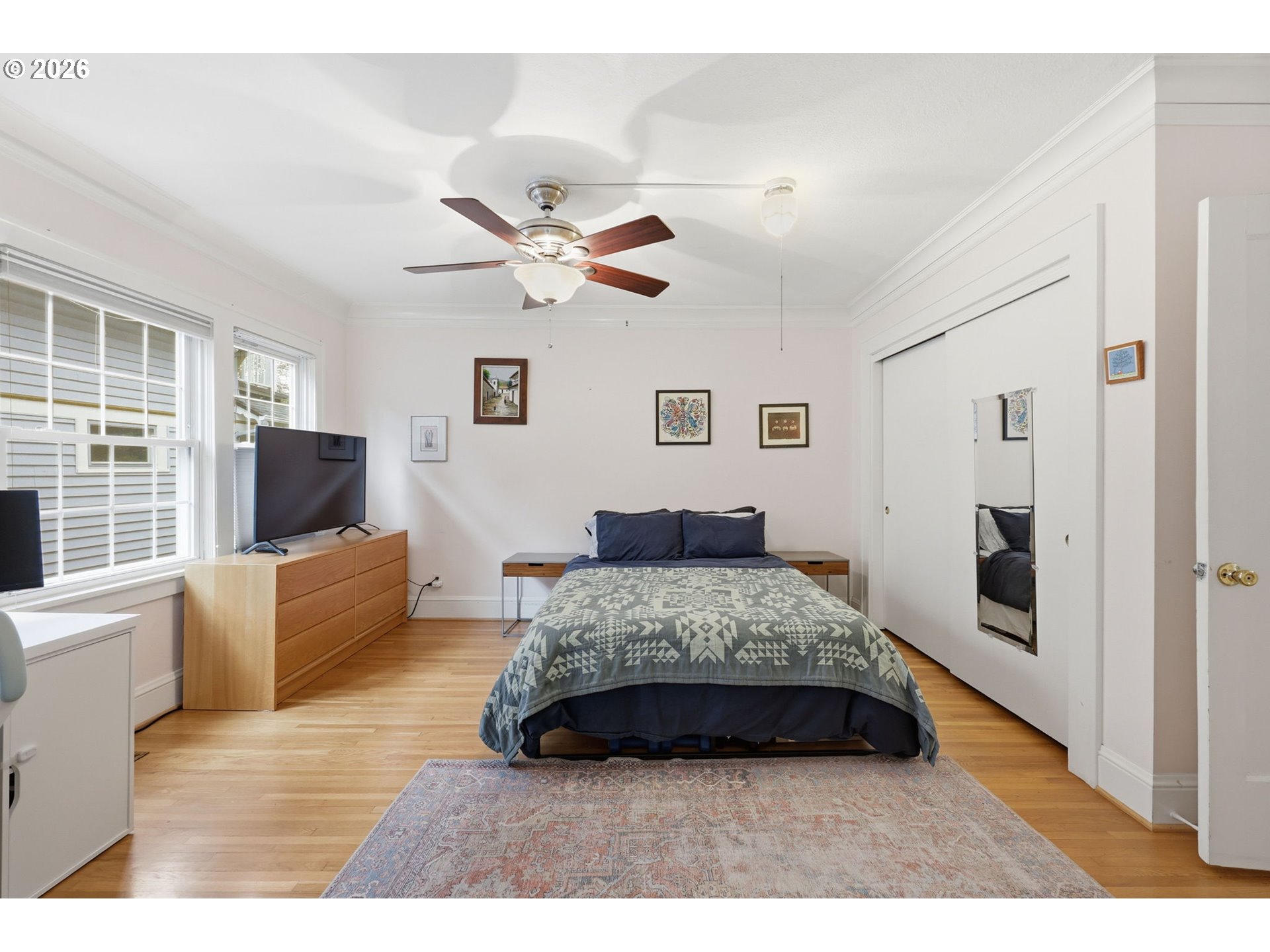 3136 Northeast Couch Street Portland, OR 97232 - Photo 17 of 48 a living room with a bed furniture and a flat screen tv