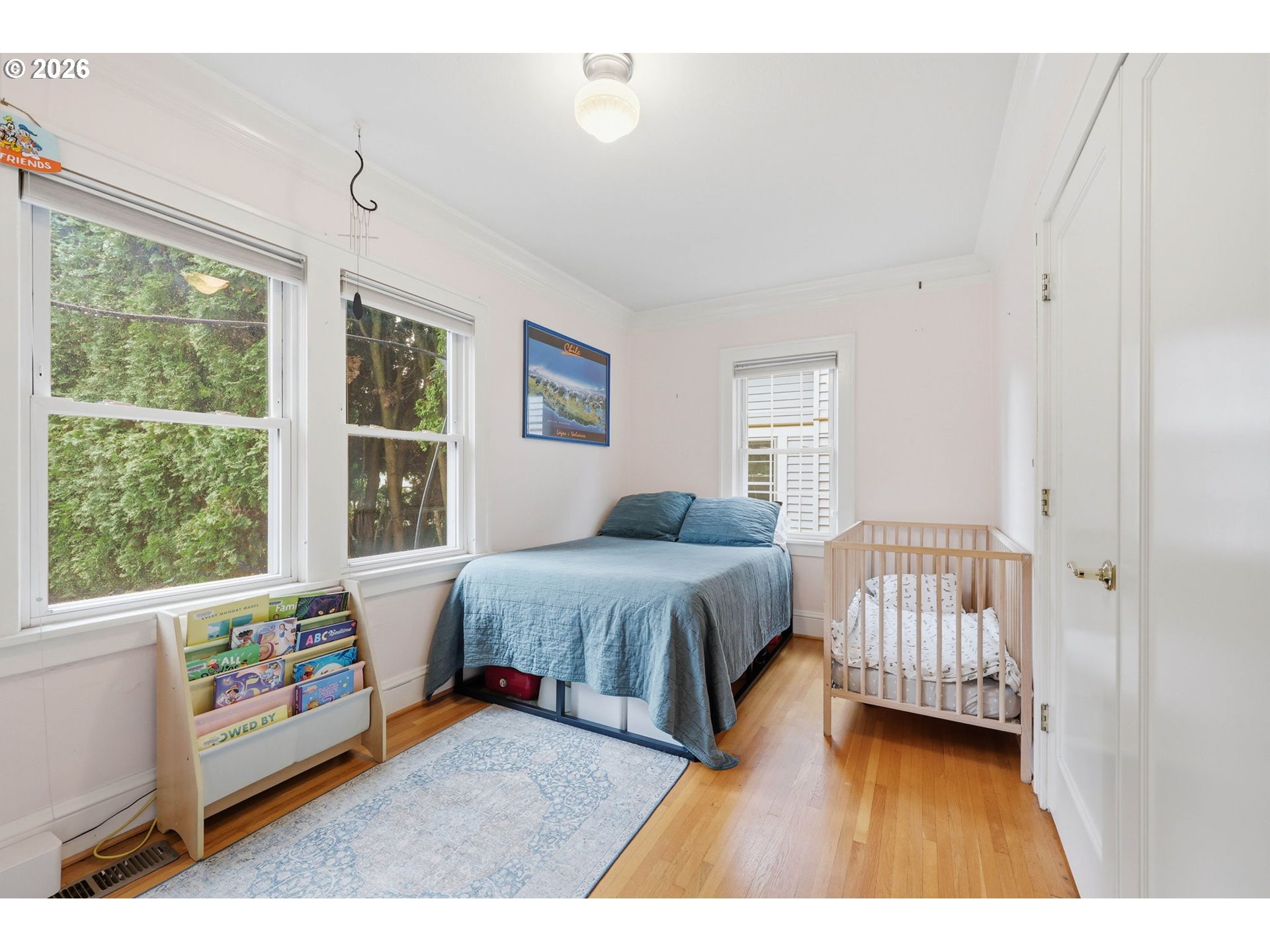 3136 Northeast Couch Street Portland, OR 97232 - Photo 19 of 48 a bedroom with a bed and a window