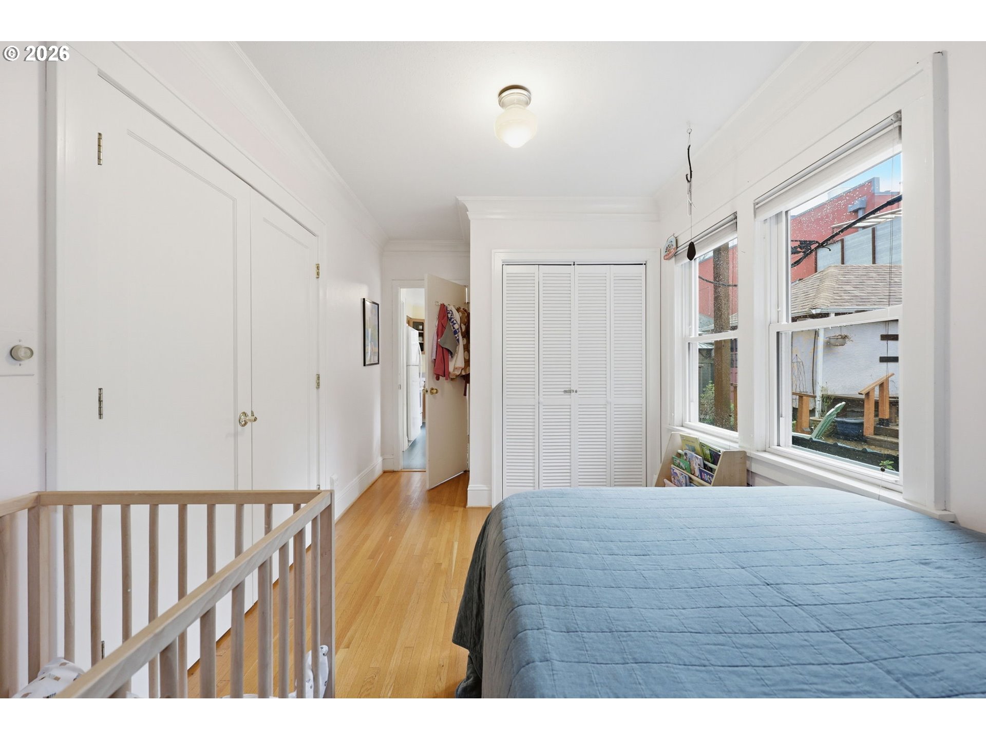 3136 Northeast Couch Street Portland, OR 97232 - Photo 20 of 48 a bedroom with a bed and a large mirror