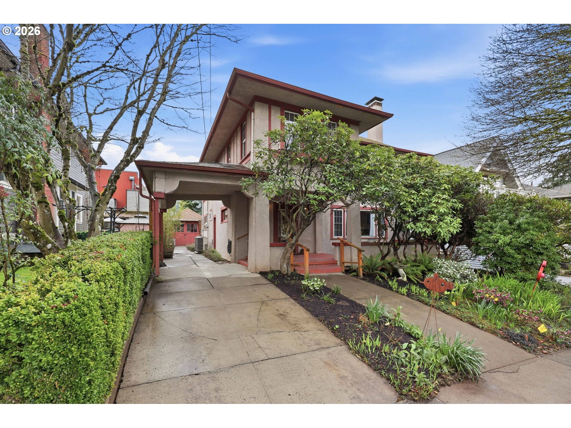 3136 Northeast Couch Street Portland, OR 97232 - Photo 2 of 48 a front view of a house with garden