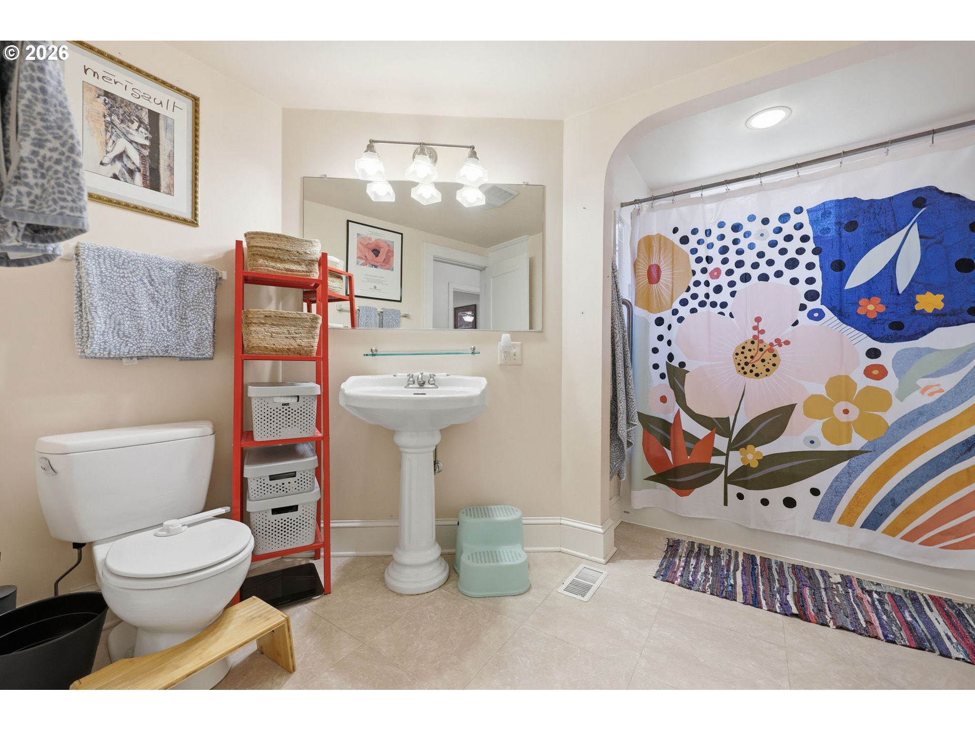 3136 Northeast Couch Street Portland, OR 97232 - Photo 21 of 48 a bathroom with a toilet a sink and a mirror