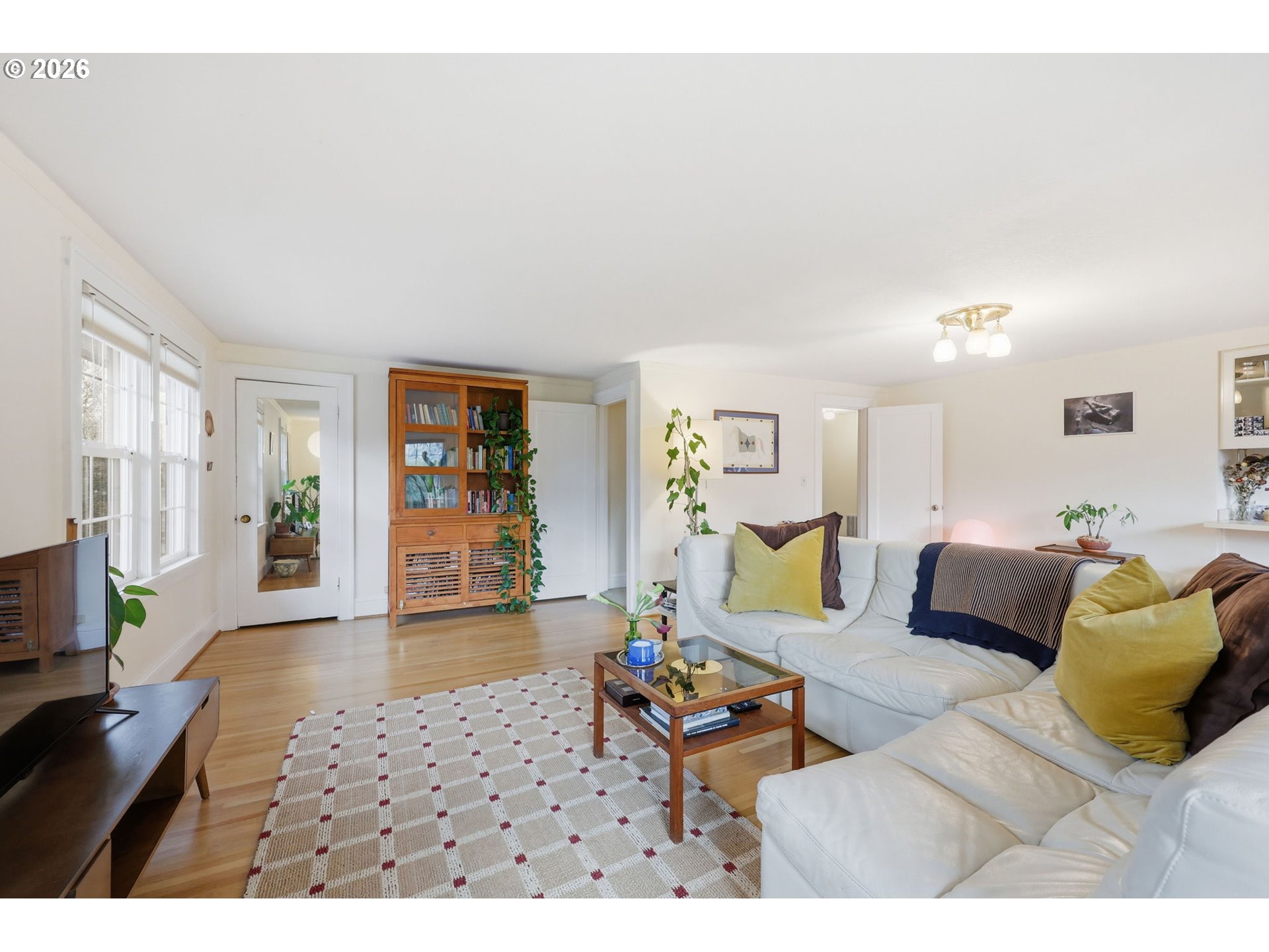 3136 Northeast Couch Street Portland, OR 97232 - Photo 26 of 48 a living room with furniture and wooden floor