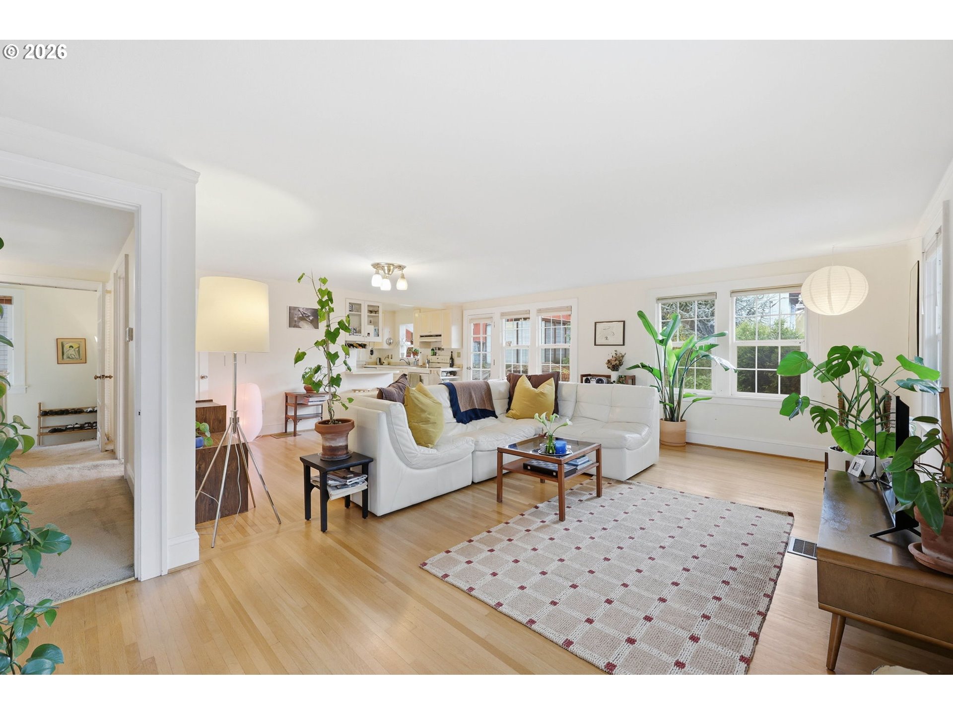 3136 Northeast Couch Street Portland, OR 97232 - Photo 27 of 48 a living room with furniture rug and a dining table