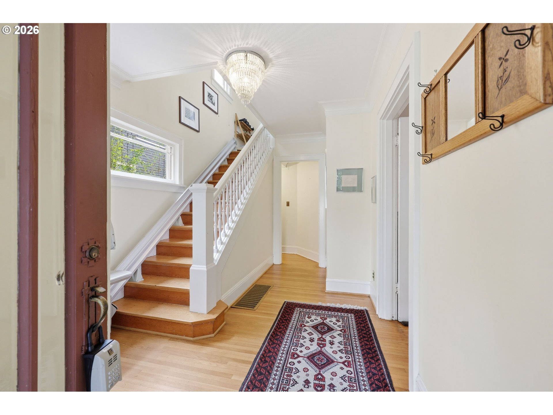 3136 Northeast Couch Street Portland, OR 97232 - Photo 8 of 48 a view of an entryway with wooden floor