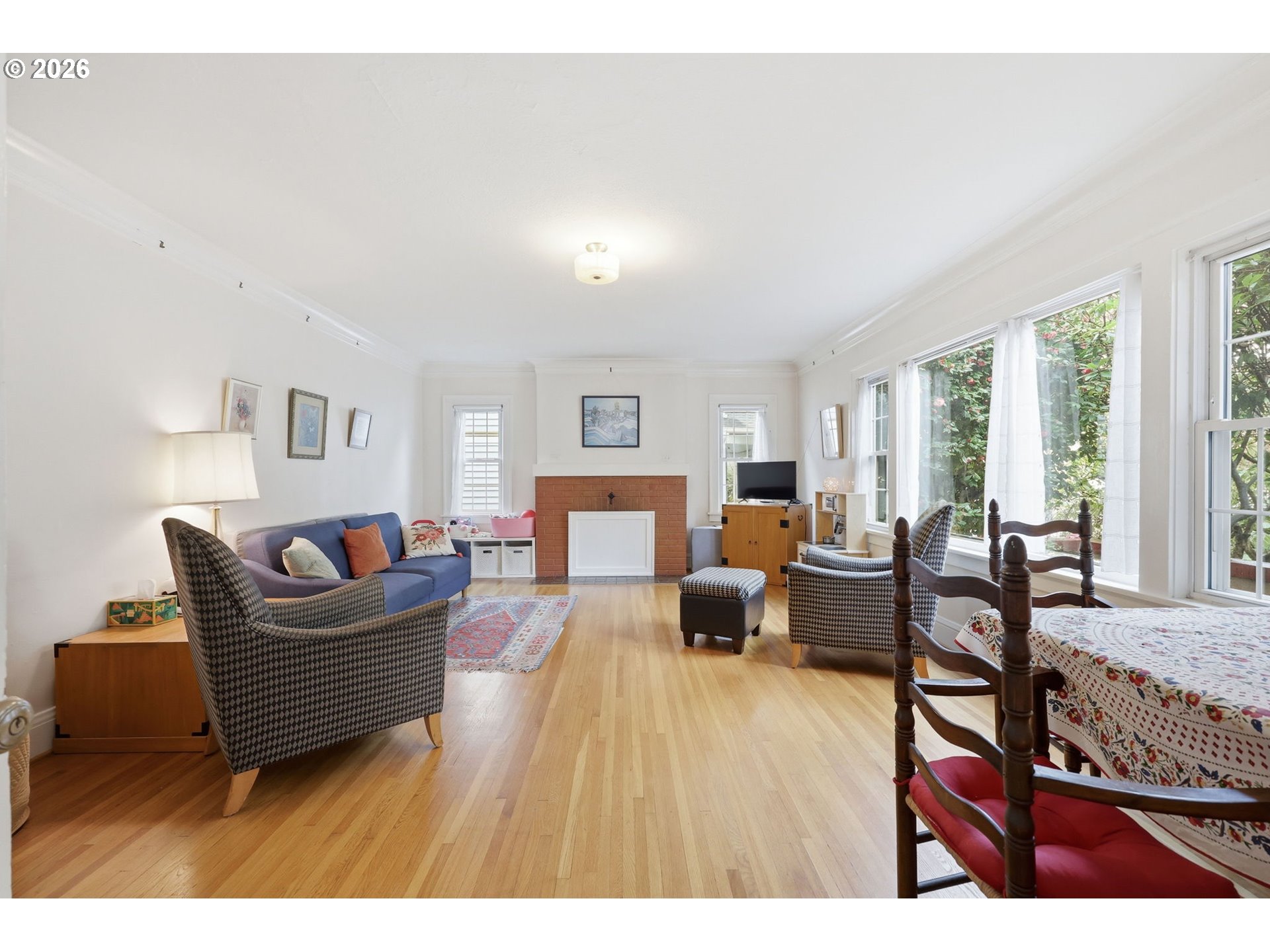 3136 Northeast Couch Street Portland, OR 97232 - Photo 10 of 48 a living room with furniture and a wooden floor