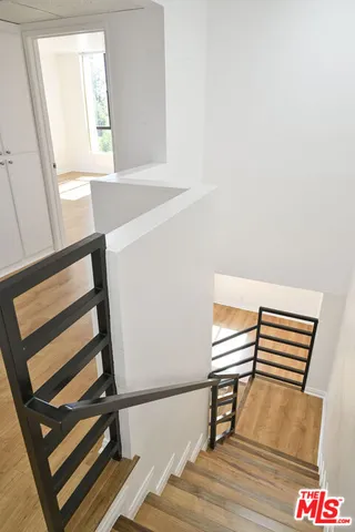 a view of wooden floor and furniture in a room