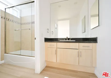 a bathroom with a shower and a bathtub