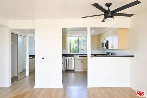 a view of a kitchen with a sink and dishwasher