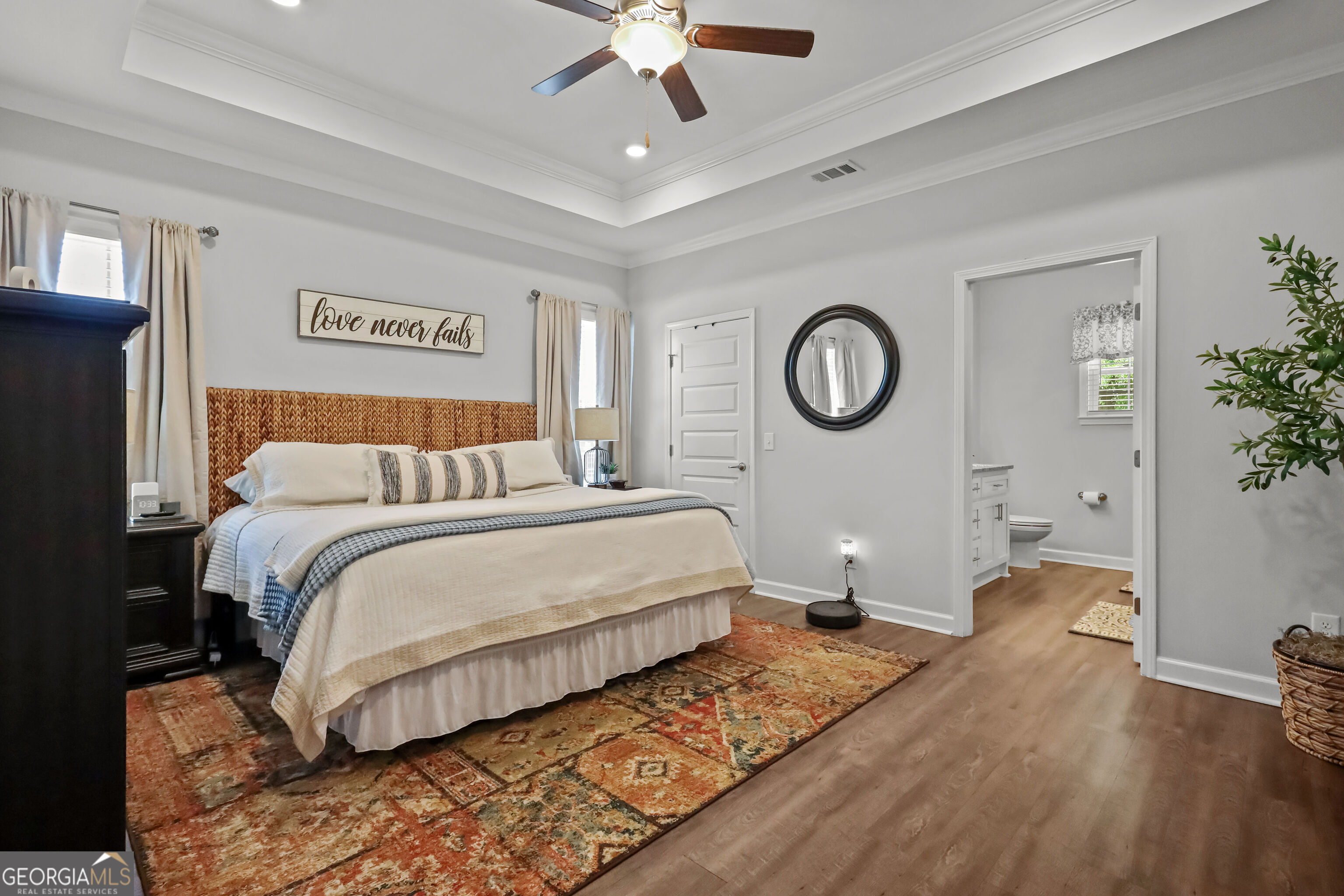 189 Common Way Jesup, GA 31545 - Photo 14 of 30 a bedroom with a bed lamp closet and a window