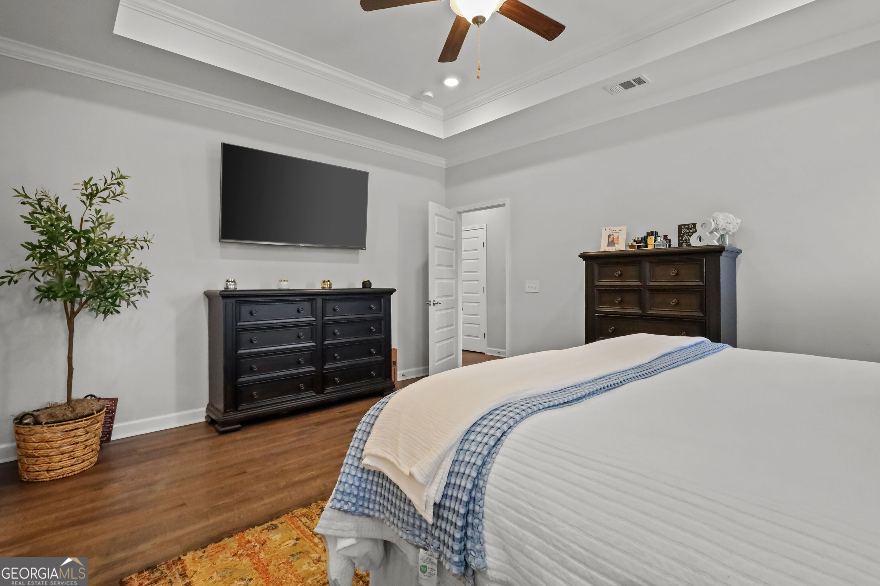 189 Common Way Jesup, GA 31545 - Photo 15 of 30 a bedroom with a bed and a flat screen television