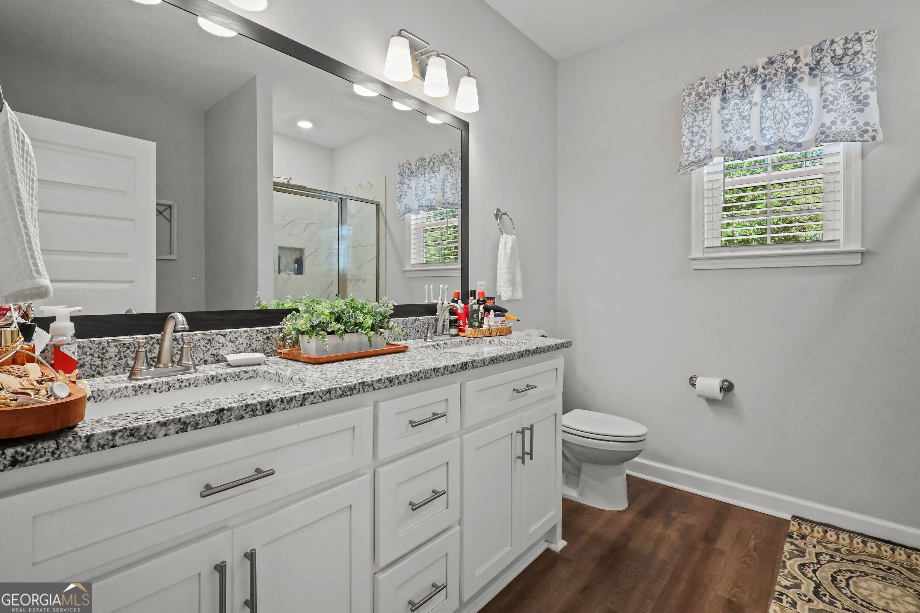 189 Common Way Jesup, GA 31545 - Photo 16 of 30 a bathroom with a granite countertop sink mirror vanity and toilet