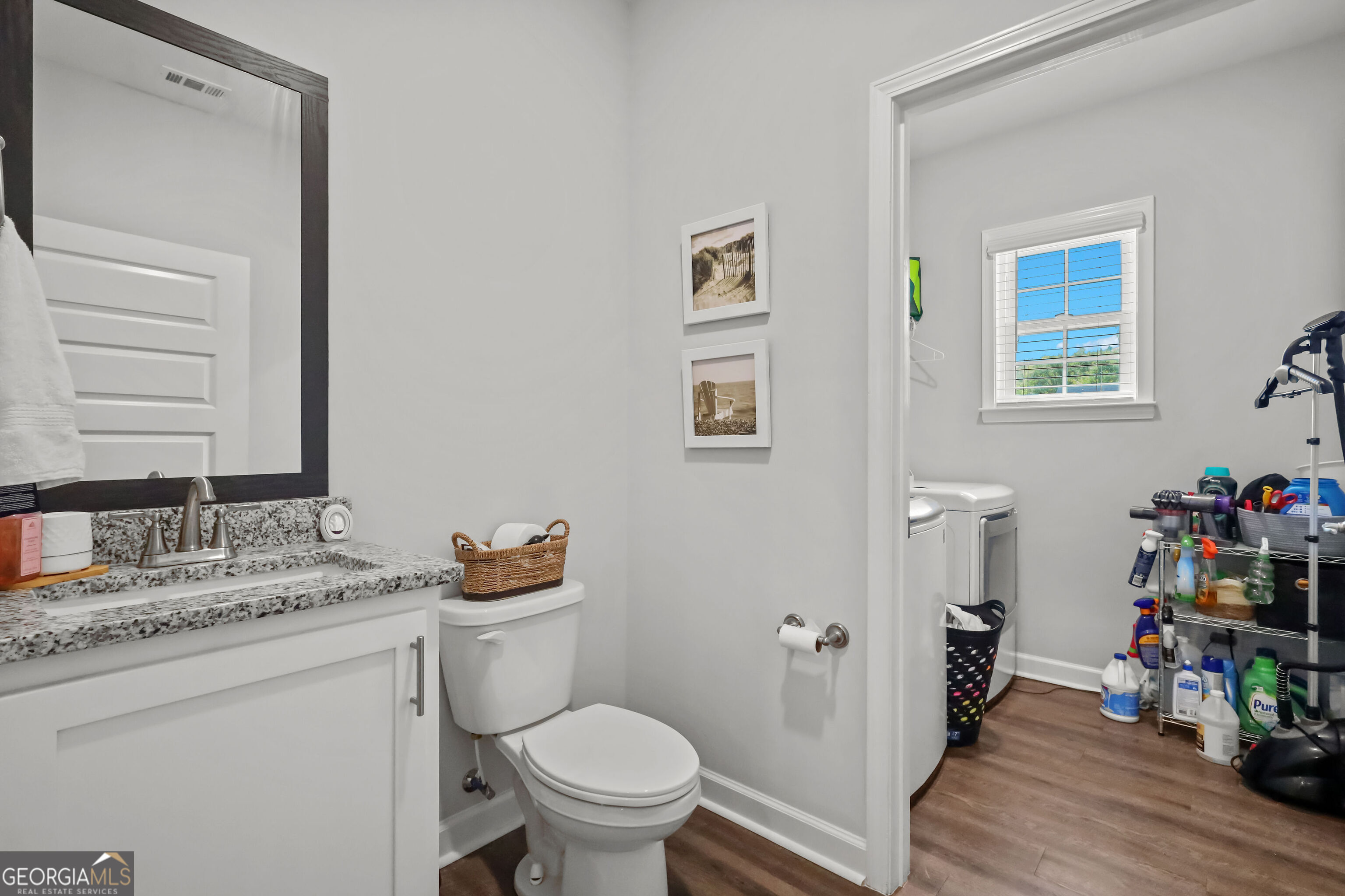 189 Common Way Jesup, GA 31545 - Photo 18 of 30 a bathroom with a granite countertop sink toilet and a mirror