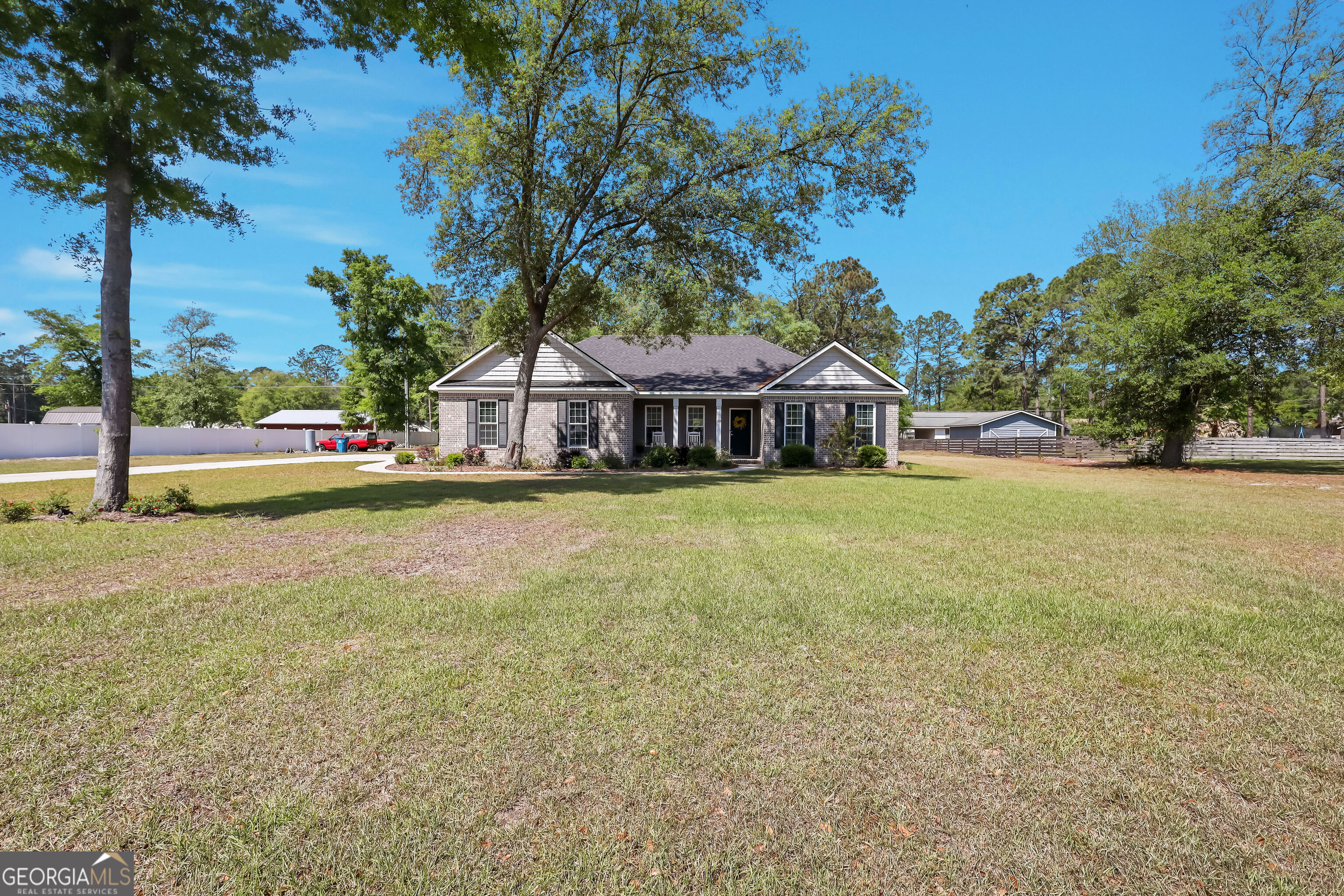 189 Common Way Jesup, GA 31545 - Photo 2 of 30 a view of a house with garden and trees