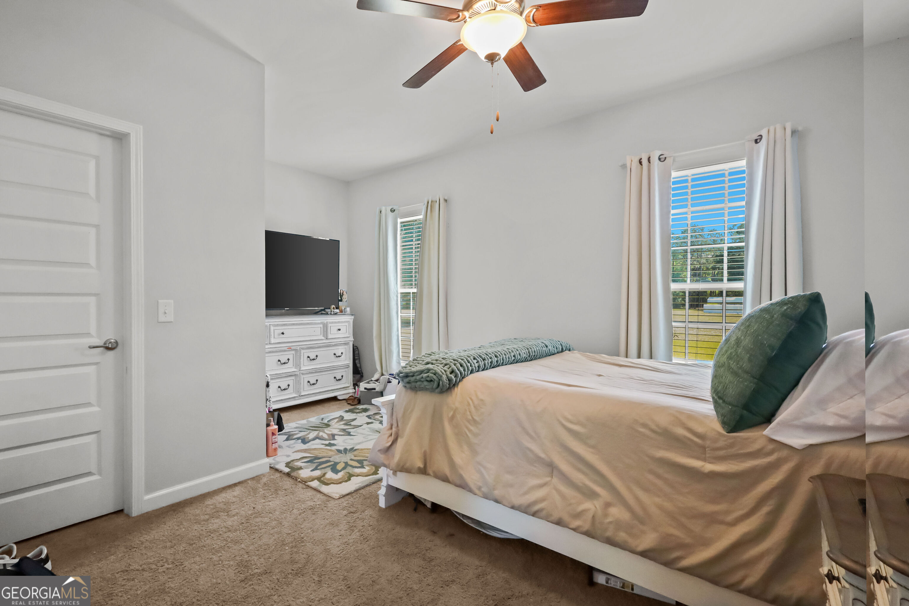 189 Common Way Jesup, GA 31545 - Photo 24 of 30 a bedroom with a bed and a flat screen tv