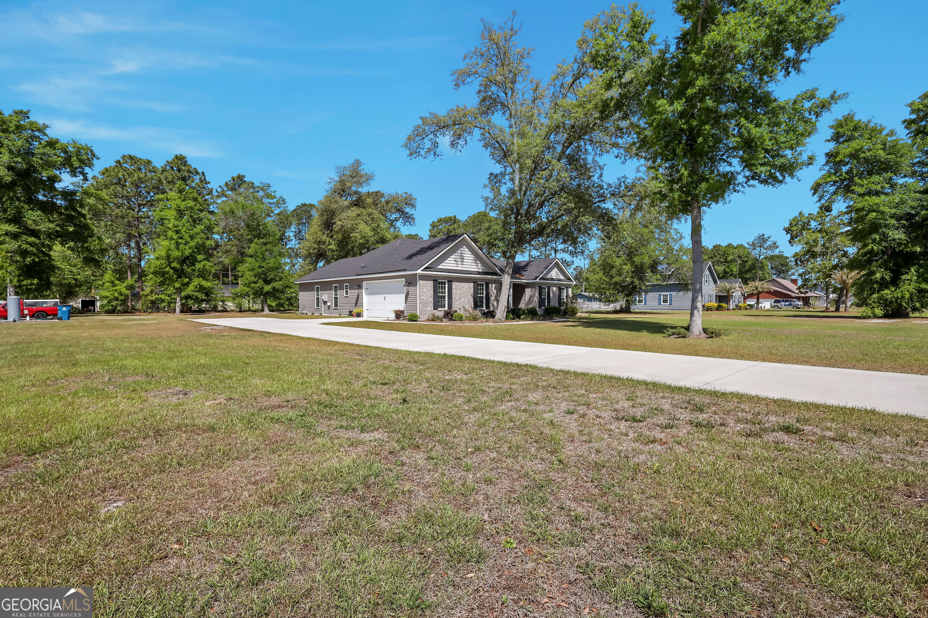 189 Common Way Jesup, GA 31545 - Photo 27 of 30 a house view with swimming pool in front of it