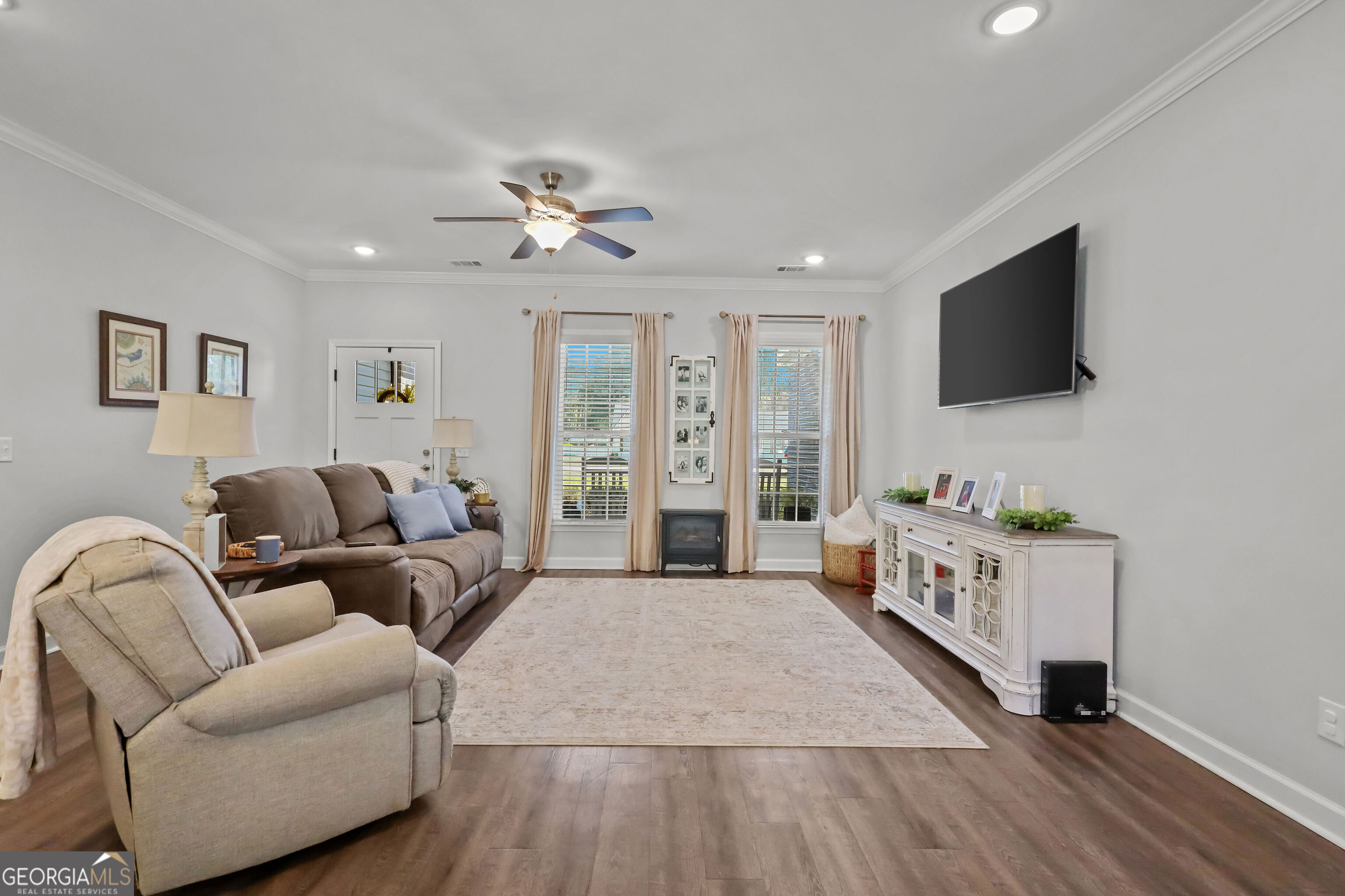 189 Common Way Jesup, GA 31545 - Photo 6 of 30 a living room with furniture and a flat screen tv