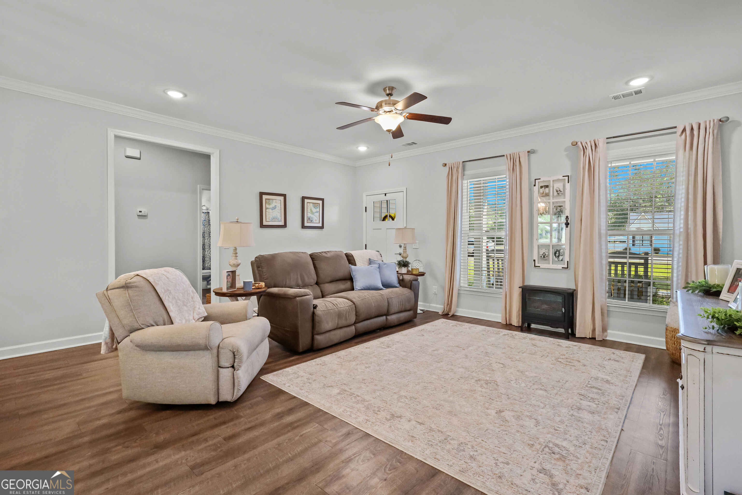189 Common Way Jesup, GA 31545 - Photo 7 of 30 a living room with furniture and a fireplace