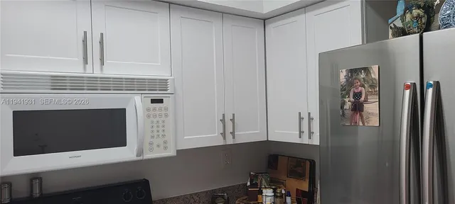 a kitchen with cabinets and a fireplace
