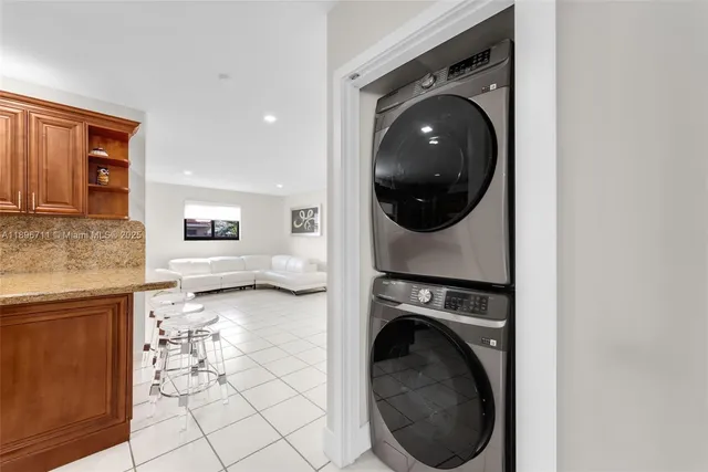 a view of a hallway with washer and dryer