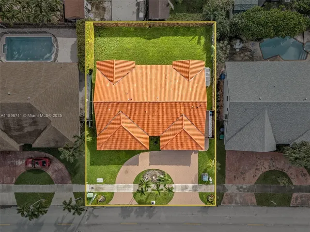 an aerial view of a house having yard