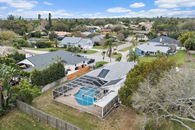 an aerial view of a house with a garden