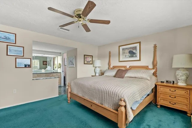 a view of a dining room with furniture wooden floor and a chandelier