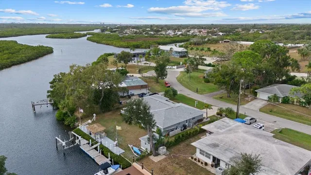 a front view of a house with garden and patio