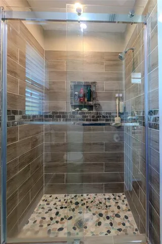 a view of a house with backyard porch and sitting area