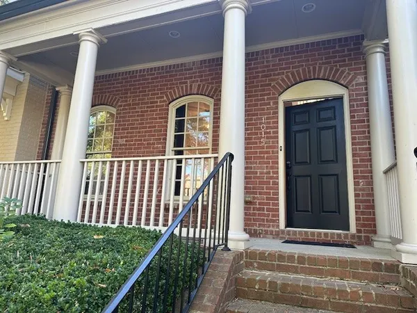 a front view of a house with a porch
