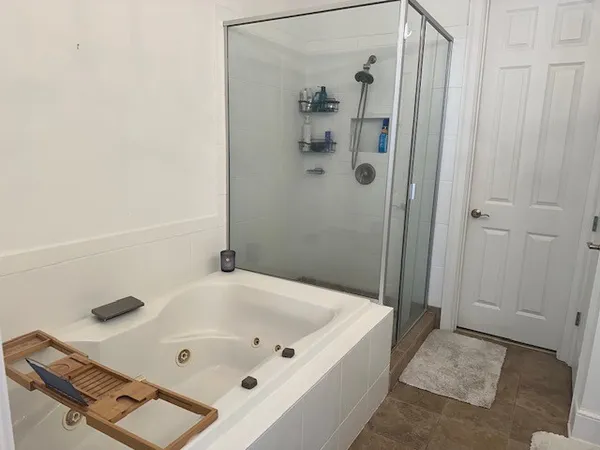 a bathroom with a tub and shower