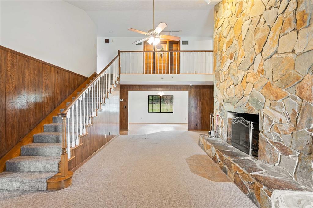 14835 Ramsey Road Dade City, FL 33523 - Photo 12 of 59 a view of entryway and hall with a fireplace
