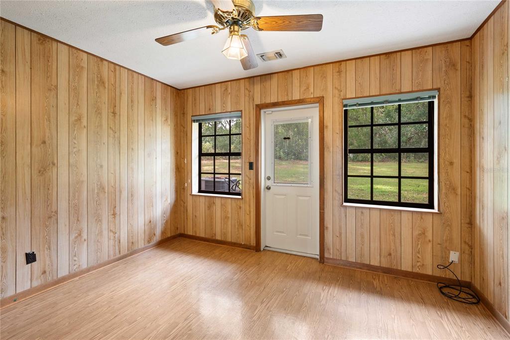 14835 Ramsey Road Dade City, FL 33523 - Photo 25 of 59 an empty room with windows