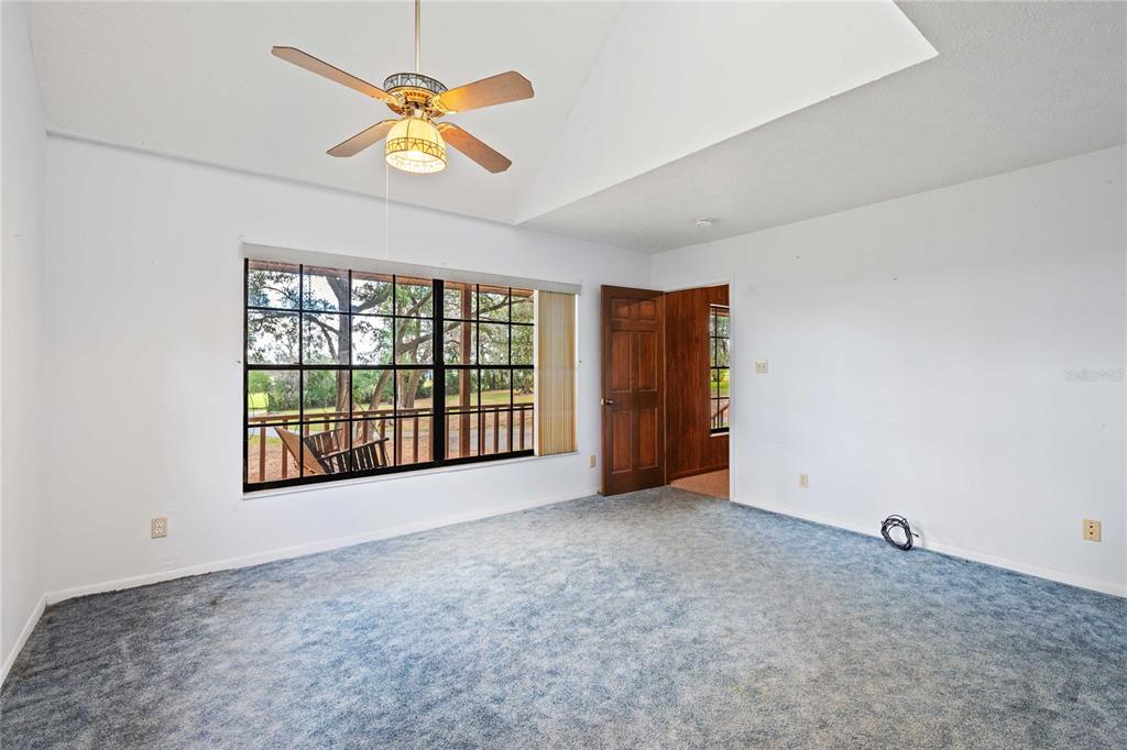 14835 Ramsey Road Dade City, FL 33523 - Photo 28 of 59 a view of an empty room with a window
