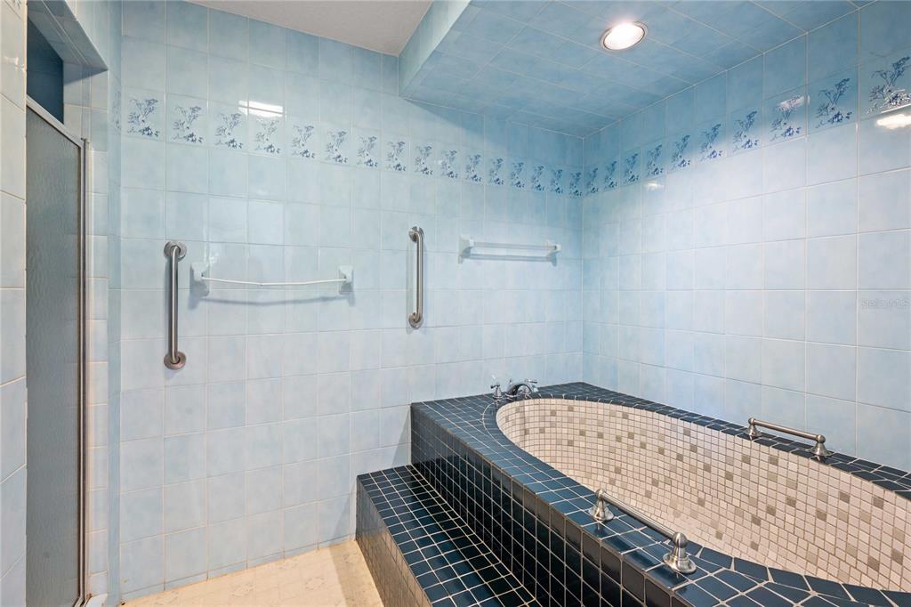 14835 Ramsey Road Dade City, FL 33523 - Photo 33 of 59 a bathroom with a granite countertop sink and a mirror