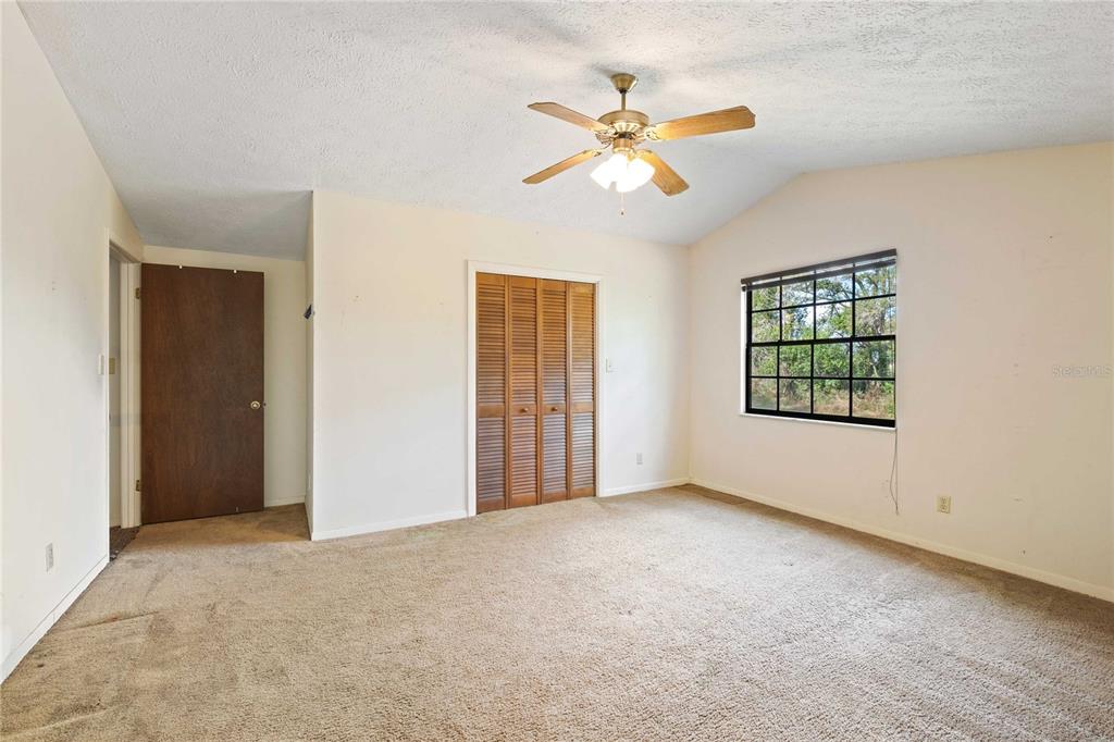 14835 Ramsey Road Dade City, FL 33523 - Photo 36 of 59 a view of an empty room with a window