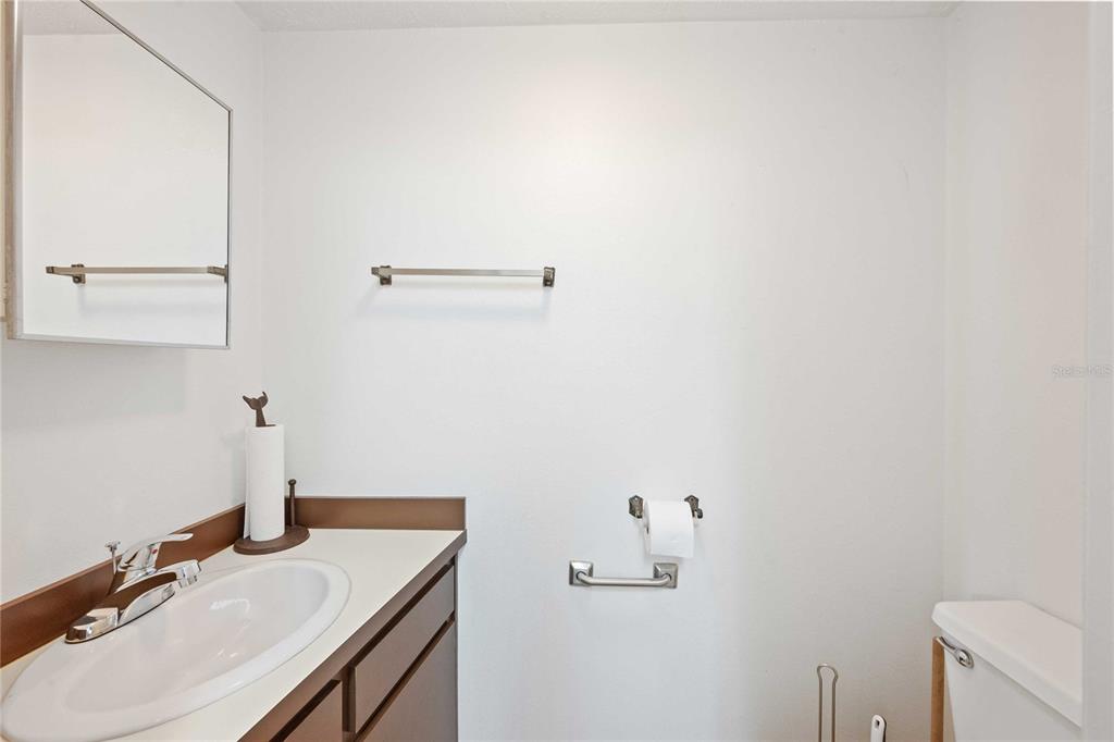 14835 Ramsey Road Dade City, FL 33523 - Photo 38 of 59 a bathroom with a sink and a vanity